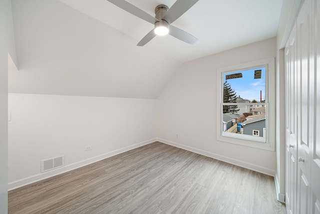 bonus room featuring vaulted ceiling, ceiling fan, and light wood-type flooring