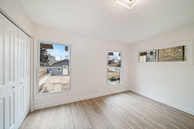 spare room featuring light hardwood / wood-style flooring