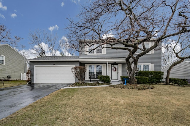 view of front facade featuring a garage and a front lawn