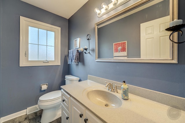 bathroom with vanity and toilet