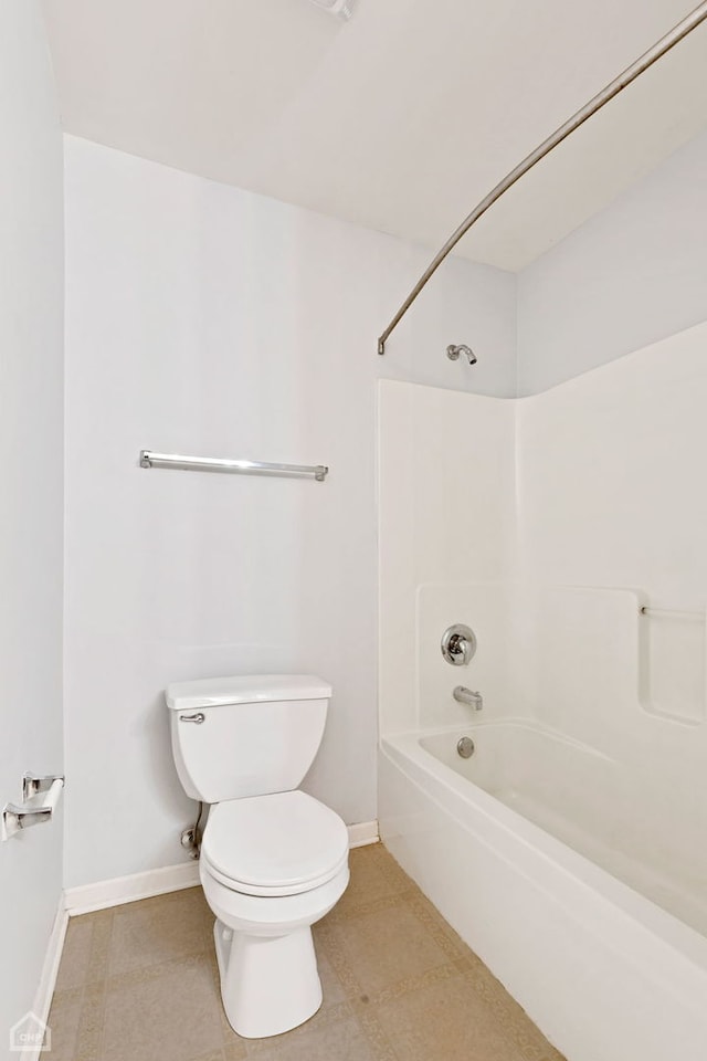 bathroom with toilet and shower / bath combination