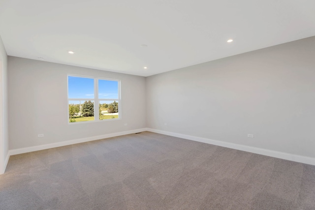 empty room featuring light colored carpet