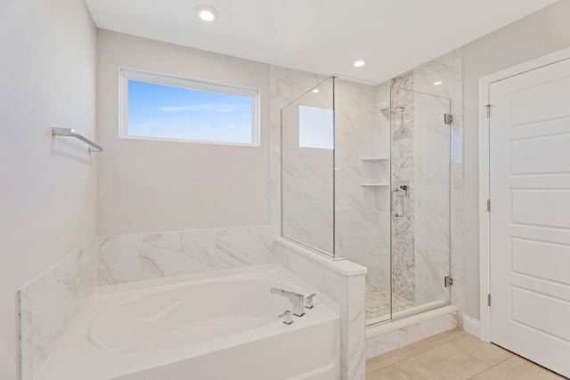 bathroom featuring separate shower and tub