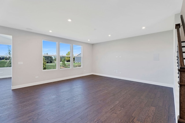 spare room with dark hardwood / wood-style floors