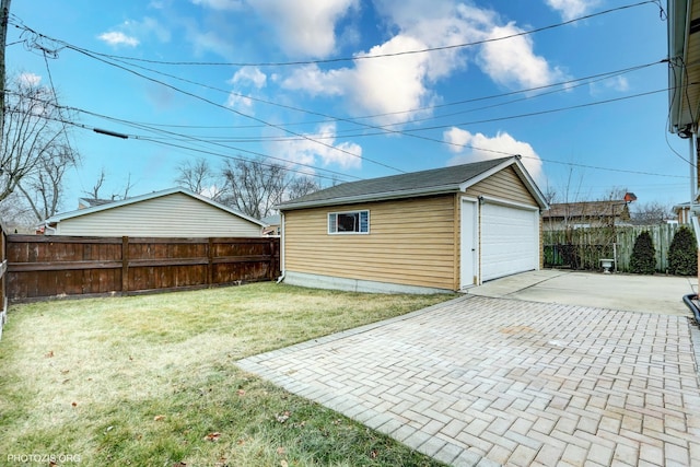 garage featuring a yard