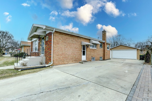 view of side of home with a garage and an outdoor structure