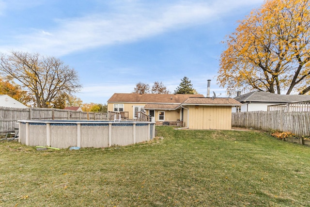 view of yard with a fenced in pool