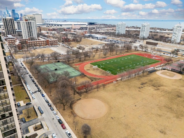 birds eye view of property with a water view