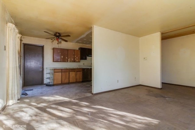 unfurnished living room with ceiling fan