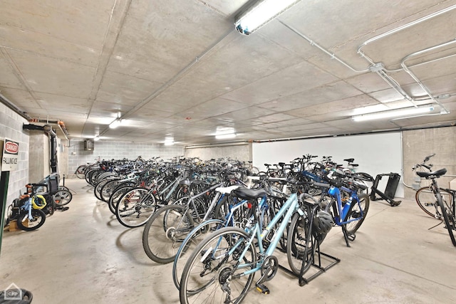 garage with concrete block wall and bike storage