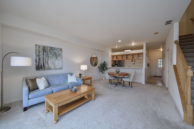 living room featuring light colored carpet