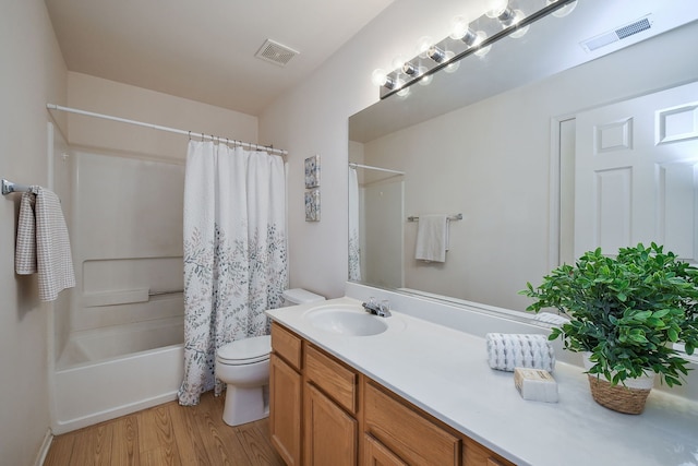 full bathroom featuring shower / bathtub combination with curtain, vanity, toilet, and wood-type flooring