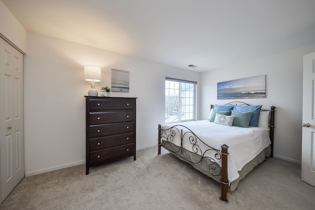 bedroom with light colored carpet