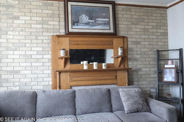 living area featuring crown molding