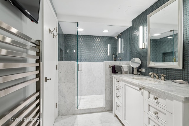 bathroom with vanity, wine cooler, and a shower with door