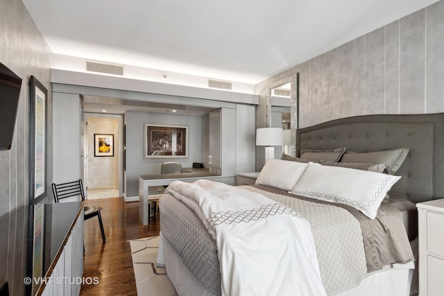 bedroom with dark wood-type flooring