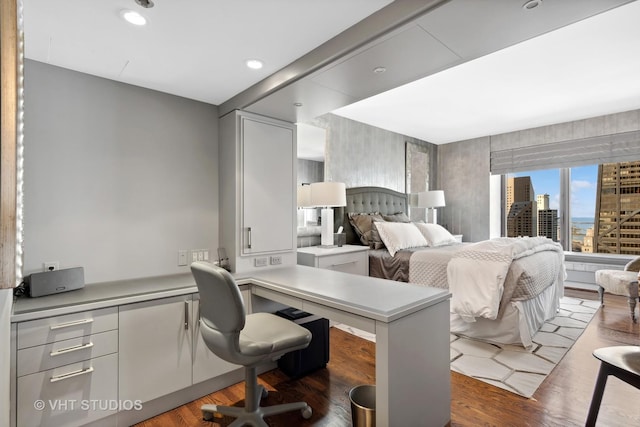 bedroom with dark hardwood / wood-style flooring