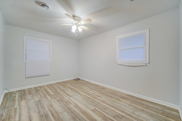 empty room with ceiling fan and light wood-type flooring