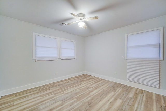 spare room with ceiling fan and light hardwood / wood-style floors