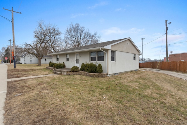 ranch-style house with a front yard