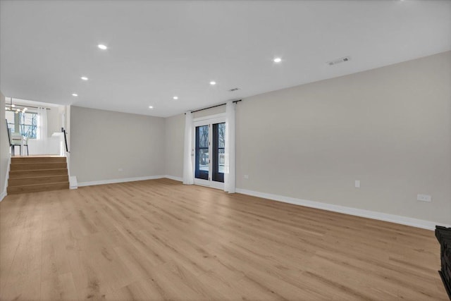 unfurnished living room featuring light hardwood / wood-style floors