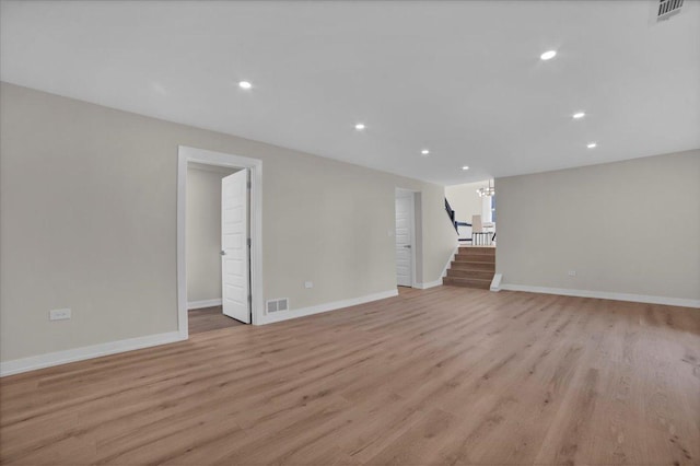 unfurnished living room with light hardwood / wood-style flooring