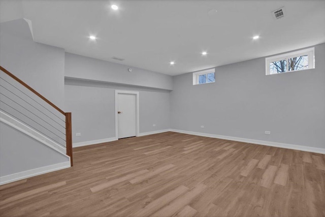 basement featuring light hardwood / wood-style flooring