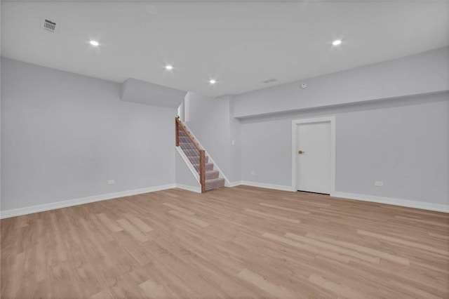 basement featuring light hardwood / wood-style flooring