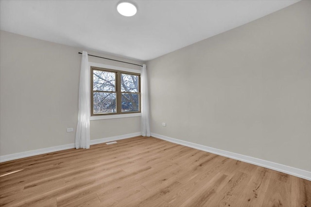 unfurnished room featuring light wood-type flooring