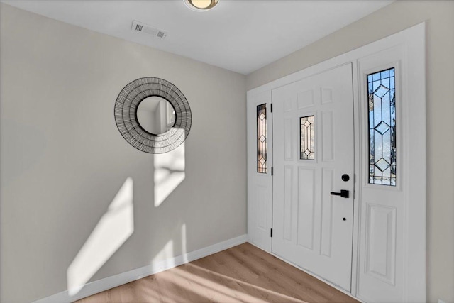 foyer entrance with light hardwood / wood-style flooring