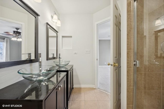 bathroom with vanity, tile patterned floors, ceiling fan, and walk in shower