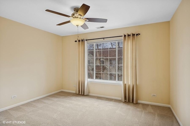 carpeted empty room with ceiling fan