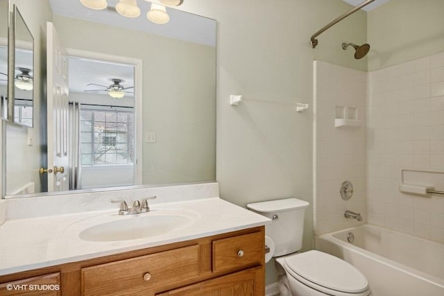 full bathroom featuring ceiling fan, vanity, toilet, and shower / bath combination