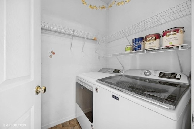 clothes washing area with washer and dryer