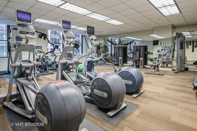 workout area featuring a drop ceiling