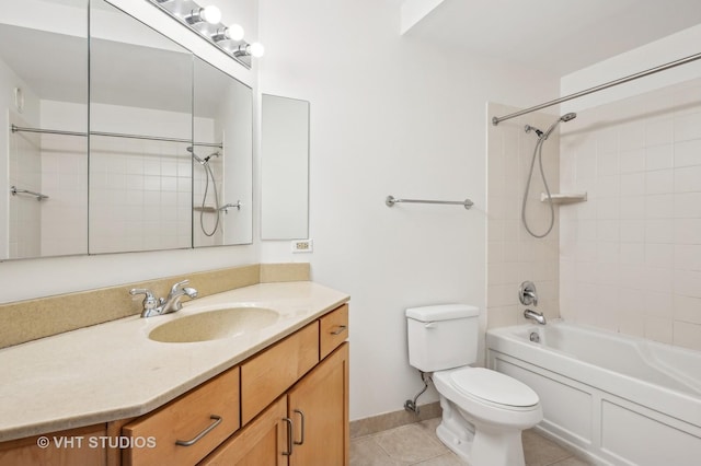 full bathroom with vanity, tiled shower / bath, tile patterned floors, and toilet