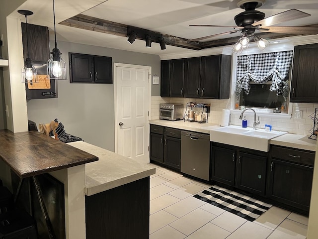 kitchen featuring sink, dishwasher, ceiling fan, tasteful backsplash, and decorative light fixtures