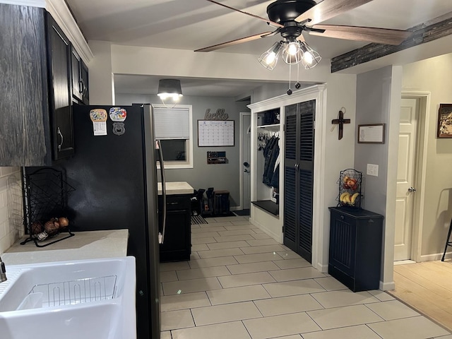 kitchen featuring ceiling fan and sink