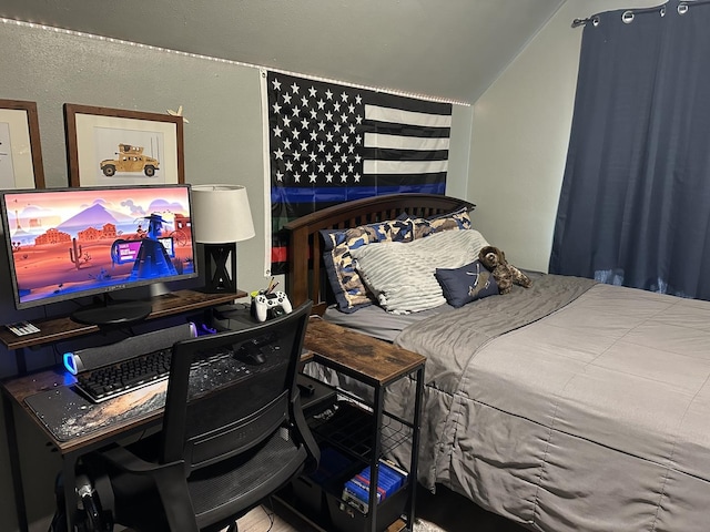 bedroom featuring vaulted ceiling