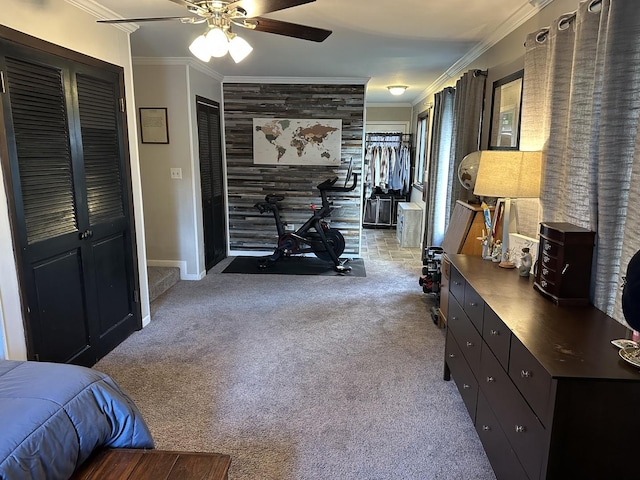 hall featuring ornamental molding and carpet floors