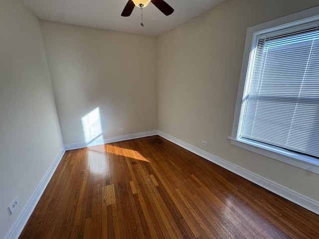 spare room with wood-type flooring and ceiling fan