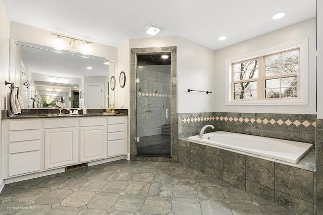 bathroom featuring vanity, tile patterned floors, and separate shower and tub