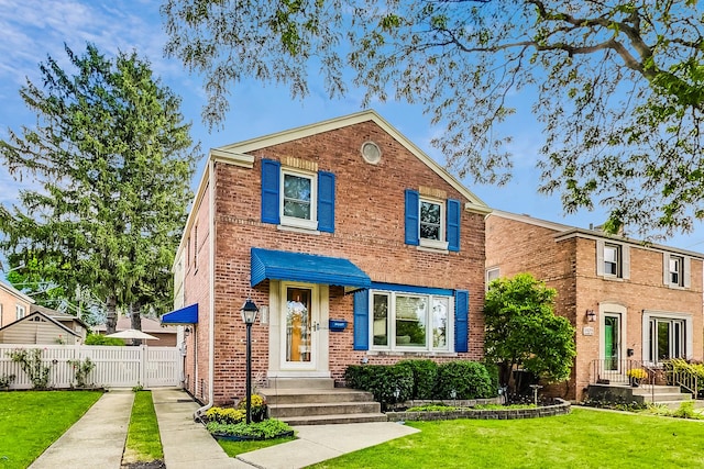 view of front facade with a front lawn