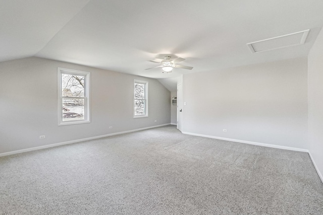 additional living space with lofted ceiling, ceiling fan, and carpet