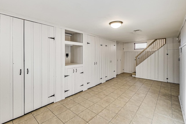 interior space featuring light tile patterned floors