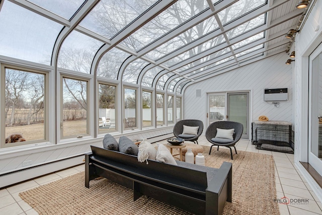 sunroom with lofted ceiling, a baseboard radiator, and plenty of natural light