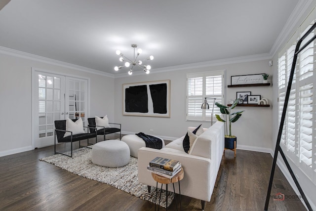 living room featuring french doors, dark hardwood / wood-style floors, crown molding, and a notable chandelier