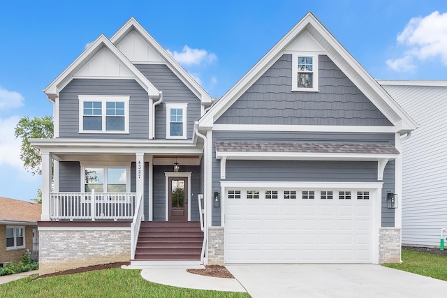 craftsman inspired home featuring a garage and a porch