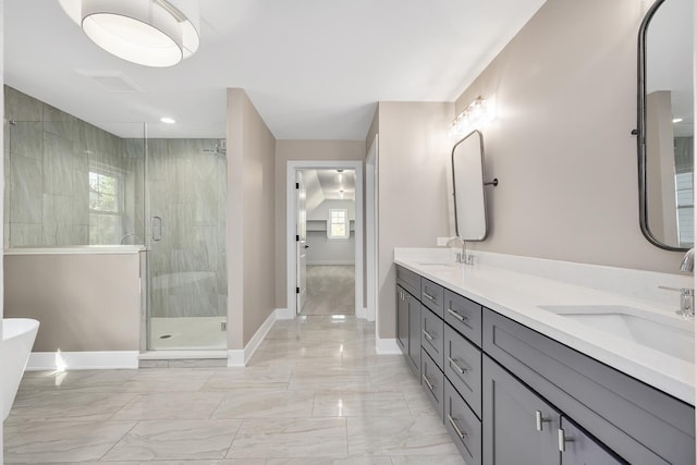 bathroom with vanity and a shower with door