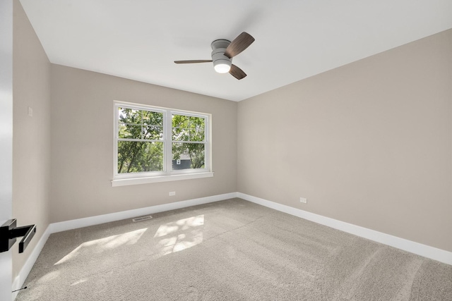 spare room with ceiling fan and carpet flooring